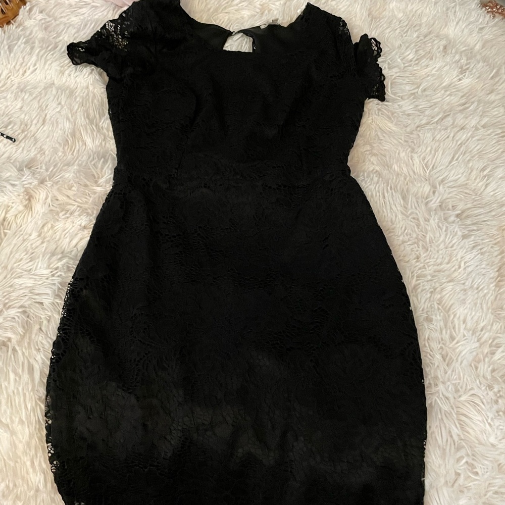 Black body on open-back lace dress